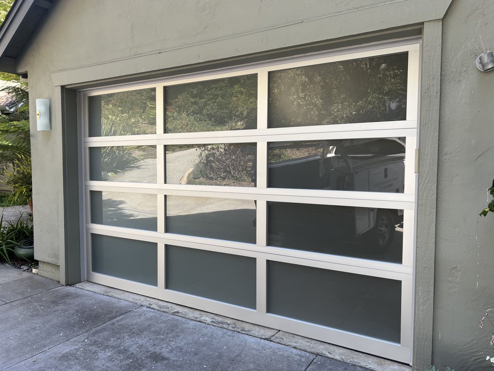 Full-view aluminum and glass garage door installation